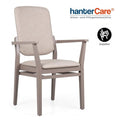 Chaise à accoudoirs empilable pour seniors INES HIGH EMP CB en bois de hêtre avec dossier haut pour établissements de soins