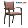 Fauteuil à accoudoirs pour seniors KATIA EST CB en bois de hêtre avec un rembourrage facile à entretenir pour les établissements de soins et les hôtels