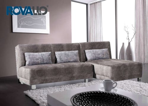 Le canapé-lit d'angle ROVALLO® VALERIE avec pouf et garniture accordéon intégrée se transforme en un lit confortable