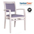 Chaise à accoudoirs empilable pour seniors KATIA ZU EMP CB en hêtre avec rembourrage robuste pour établissements de soins et hôtels